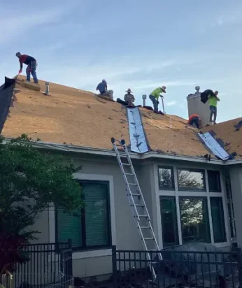 crew repairing a roof