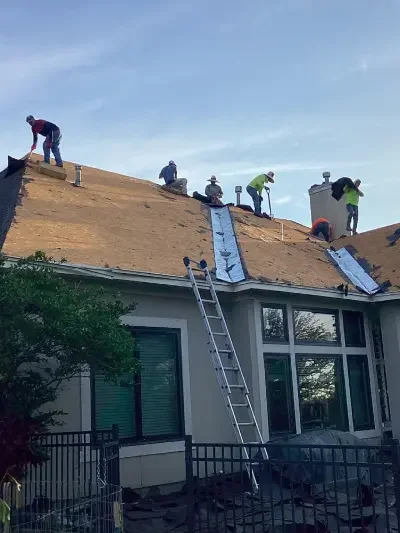 crew repairing a roof